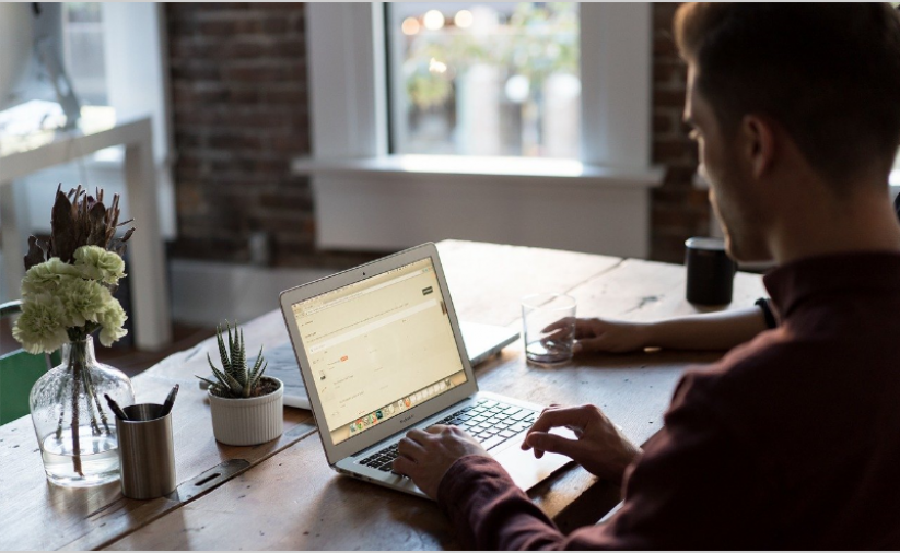 A person sits at a computer.