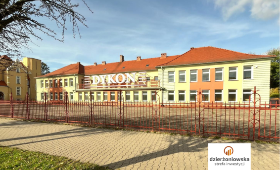 Building with colorful facade. Logo Dzierżoniowska Investment Zone.