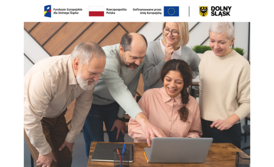 A group of 5 people are talking while standing in front of a computer. Logos: European Funds from Lower Silesia, Lower Silesia, Republic of Poland, Co-financed by the European Union.