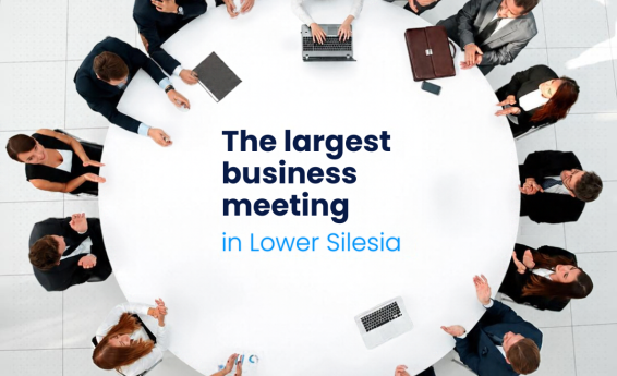 A group of people sitting around a round table. Text: “Business Mixer – The Largest Networking Event in Lower Silesia.”